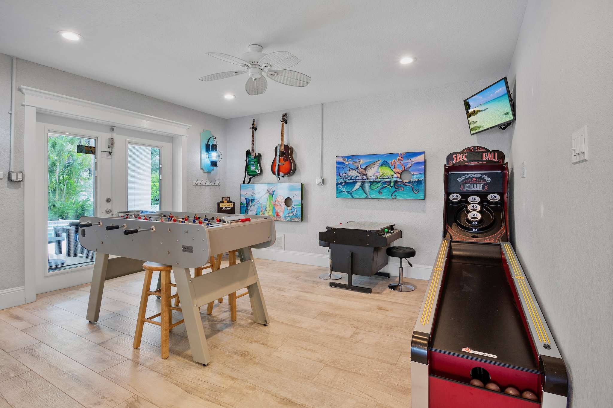 Salty Margarita game room with guitars, foosball and skee-ball